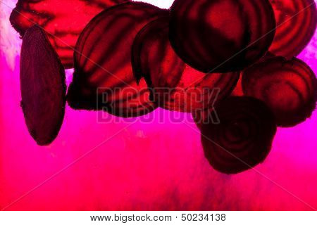 Close up of sliced raw beet in water