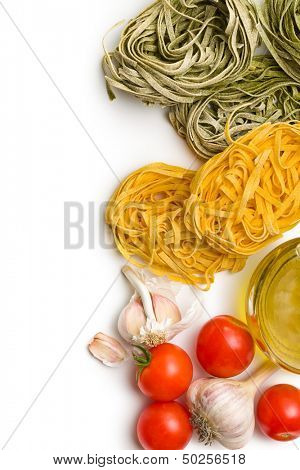 tagliatelle with tomatoes and garlic on white background