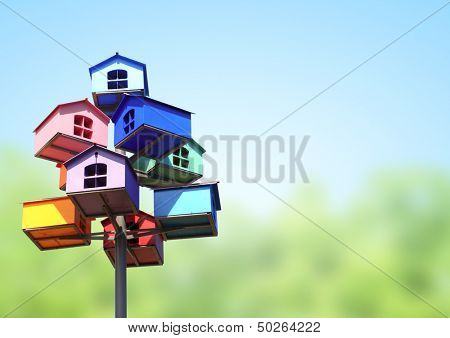Colorful nesting boxes on blue sky