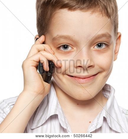 Boyl, speaking on the phone. Child talking on mobile phone