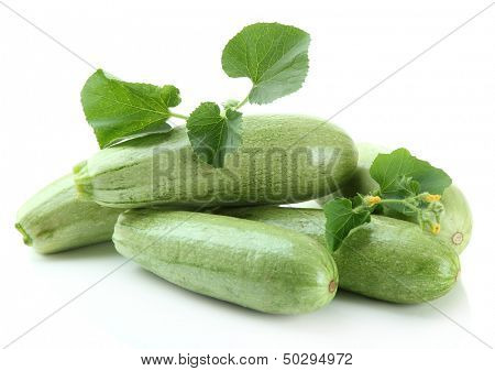Raw zucchini with leaves, isolated on white