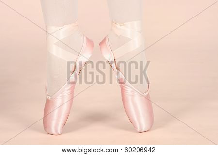 A Ballet Dancer Standing On Toes While Dancing