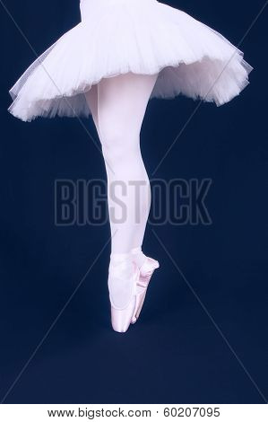 A Ballet Dancer Standing On Toes While Dancing