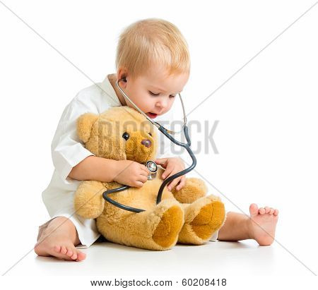 Adorable Child With Clothes Of Doctor And Teddy Bear Over White