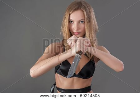Pretty girl with knife