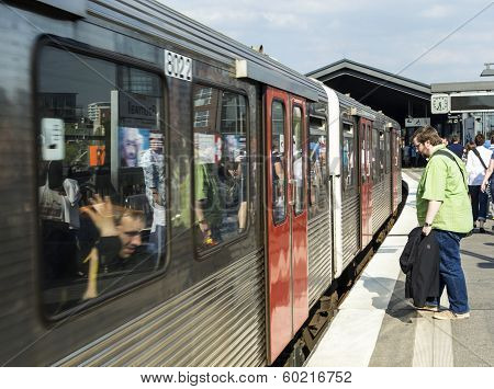 People Enter The Train At Baumwall U-bahn Station