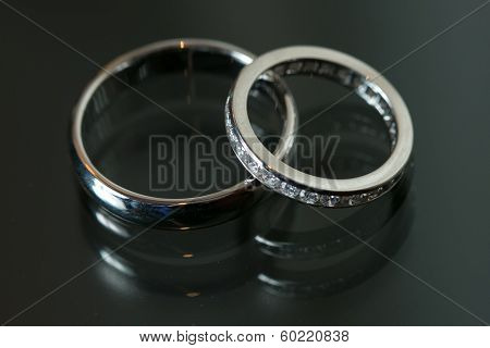 Couple Of Wedding Rings On Grey Background