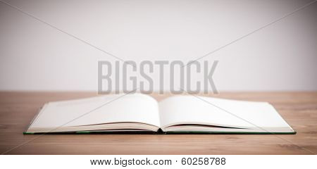   open book on wooden deck
