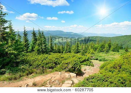 High mountains and sun on blue sky                                    