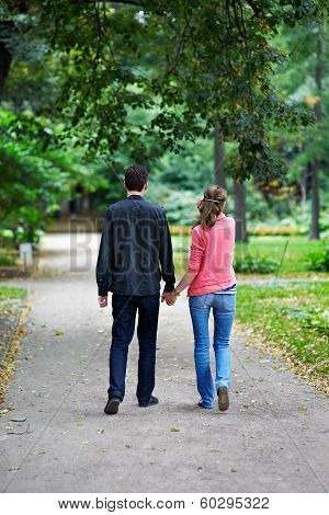 Man And Woman On A Walk In Park