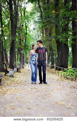 Man And Woman On A Walk In Park