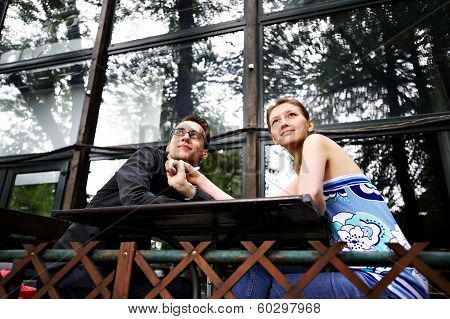 Man And Woman At A Table In Cafe