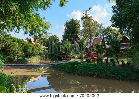 Tropical Park With Wooden Long Rope Bridge