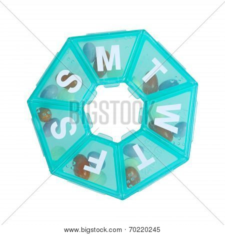 Green Pill Dispenser In The Shape Of A Wheel