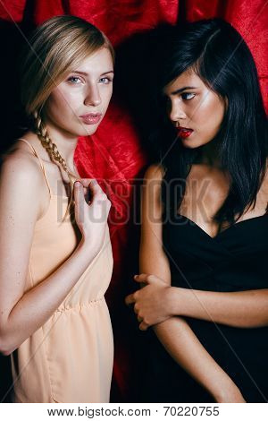 brunette and blond woman together, conflict of types
