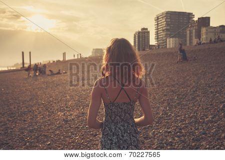 Young Woman On The Beach At Sunset