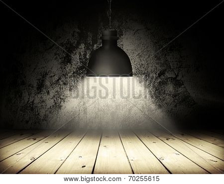 Black grunge wall and black plafond are lights wall and floor fom wooden boards