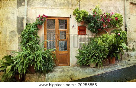 Vintage photo of traditional house in mediterranean village in Mallorca, Spain
