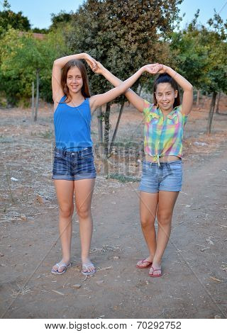 Two Best Friend Girls Making A Forever Sign
