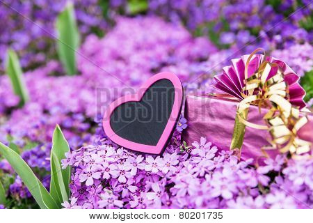 Beautiful Sea Of Flowers With A Pink Heart And A Gift
