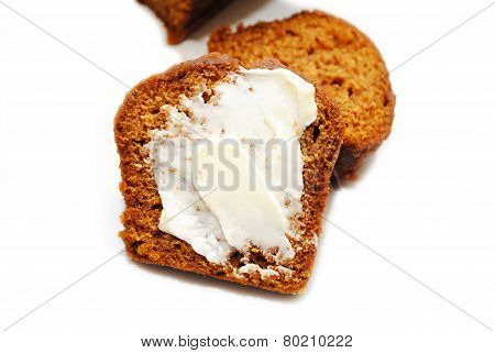 Butter Spread Onto A Slice Of Pumpkin Bread