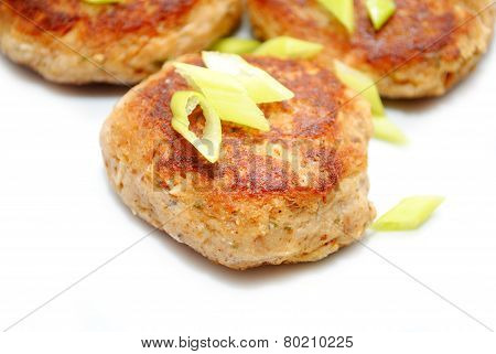 Close Up Of Fish Cakes With Sliced Scallions