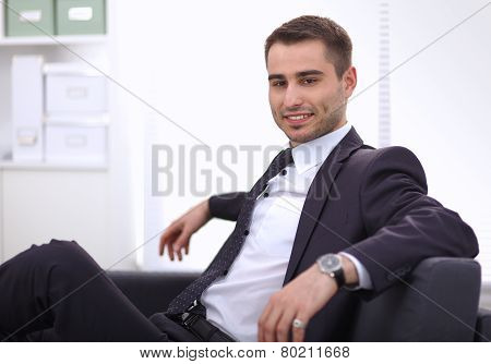young businessman sitting in his office