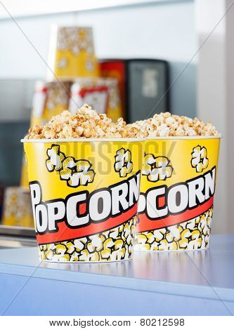 Popcorn buckets on cinema concession counter