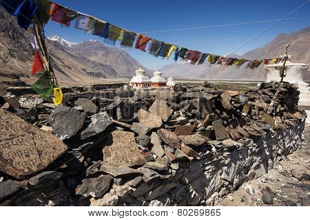 Stupa and player flags near Diskit monastery in Ladakh, Jammu & Kashmir, India - September 2014