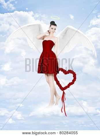 Beautiful Brunette Woman As Cupid With Heart Made Of Roses