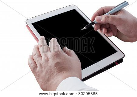 Businessman Holding Pen On The Tablet On The Desk.