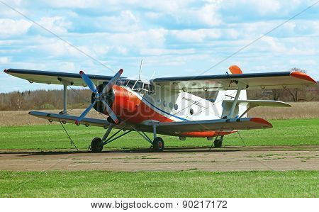 The old biplane aircraft in the airport.