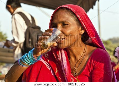 Woman Drinking Tea In The Meena Bazaar In Delhi