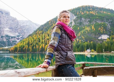 Woman Hiker Rests, Facing Away From Lake Bries