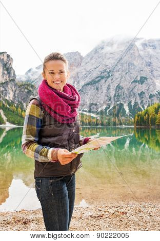 Smiling Woman Hiker Holding Map On The Shores Of Lake Bries