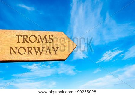 Wooden arrow sign pointing touristic destination