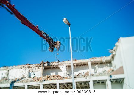 Bulding Demolition Destruction By The Articulating Mechanical Jaws