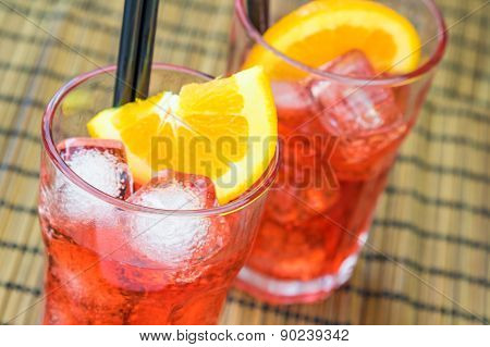 Two Glasses Of Spritz Aperitif Aperol Cocktail With Two Orange Slices And Ice Cubes