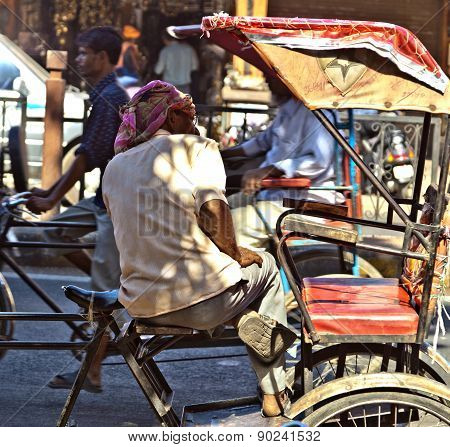 Man Rests In His Cycle Rickshaw