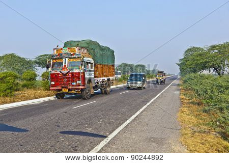 People In Overloaded Cars On The Highway Between Delhi And Agra