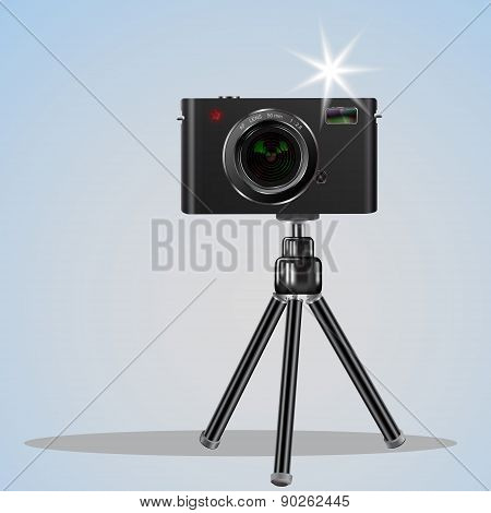 Abstract Digital Photo Camera On Small Tripod.