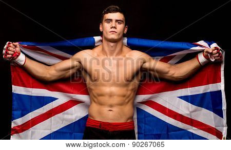 Portrait of boxer posing studio in gloves.