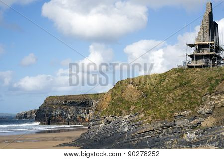 Castle Surrounded By Scafolding On Cliffs