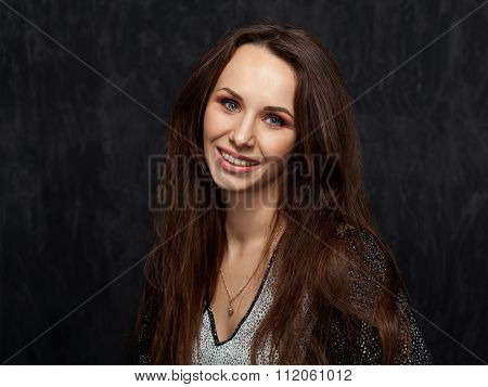 Beautiful Brunette On A Dark Background