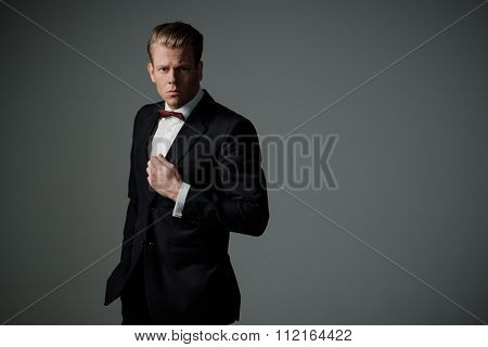 Sharp dressed man wearing jacket and bow tie