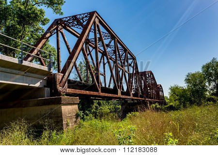 An Interesting View Of An Old Iconic Iron Truss Railroad Bridge