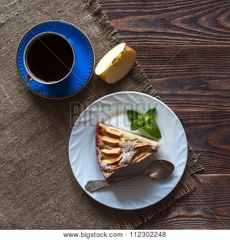 Piece of apple pie on white plate