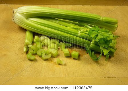 Bunch Of Fresh Green Celery On Pastry Board