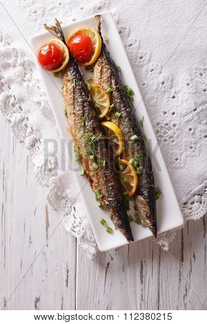 Saury Grilled With Vegetables On A Plate. Vertical Top View