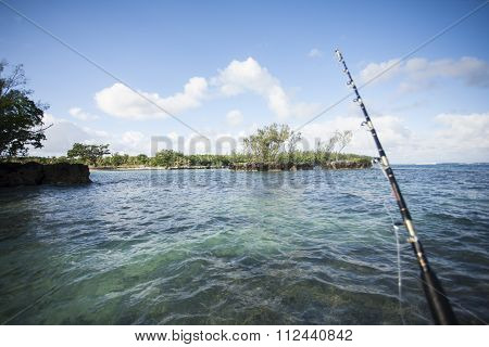 Fishing Rod Above Shallow Water